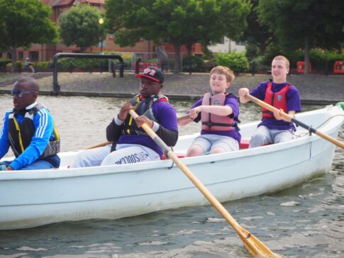 Picture of 4 young people rowing the Trinity boat